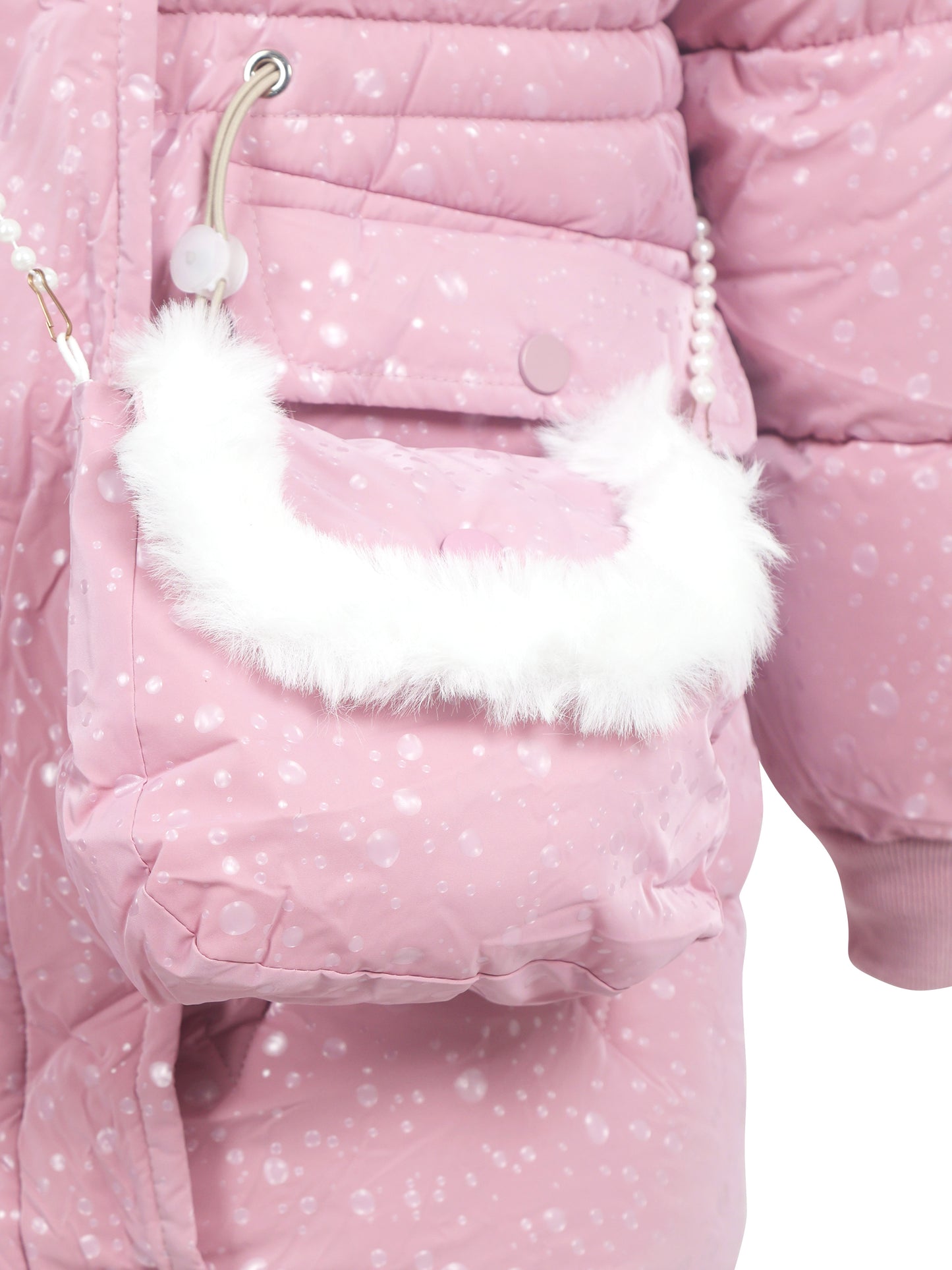 Close-up of a light pink winter coat pocket with matching detachable bag, featuring a white faux fur trim and pearl strap, with visible water droplets on the fabric.