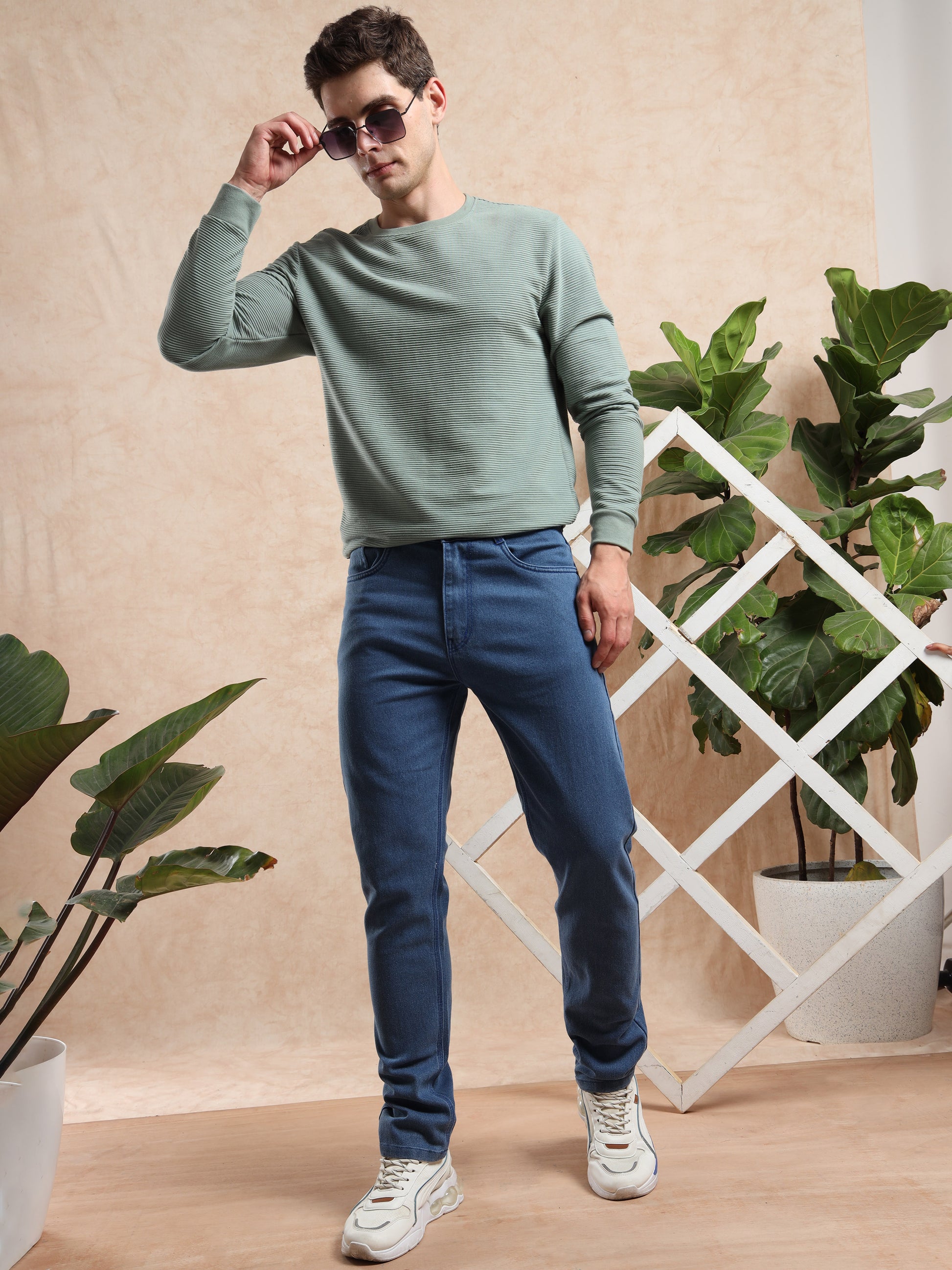 slim fit blue jeans with casual sweatshirt and sneakers