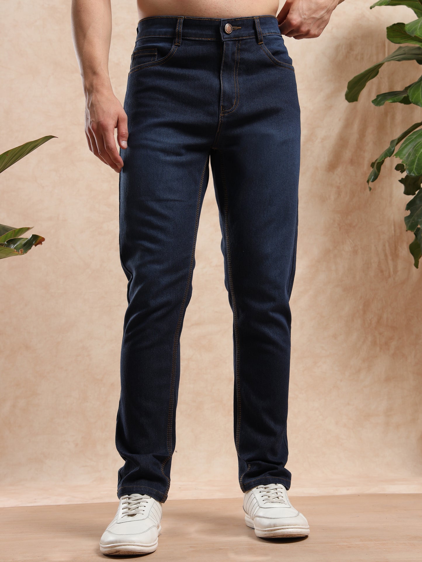 Men’s slim fit dark blue denim jeans paired
