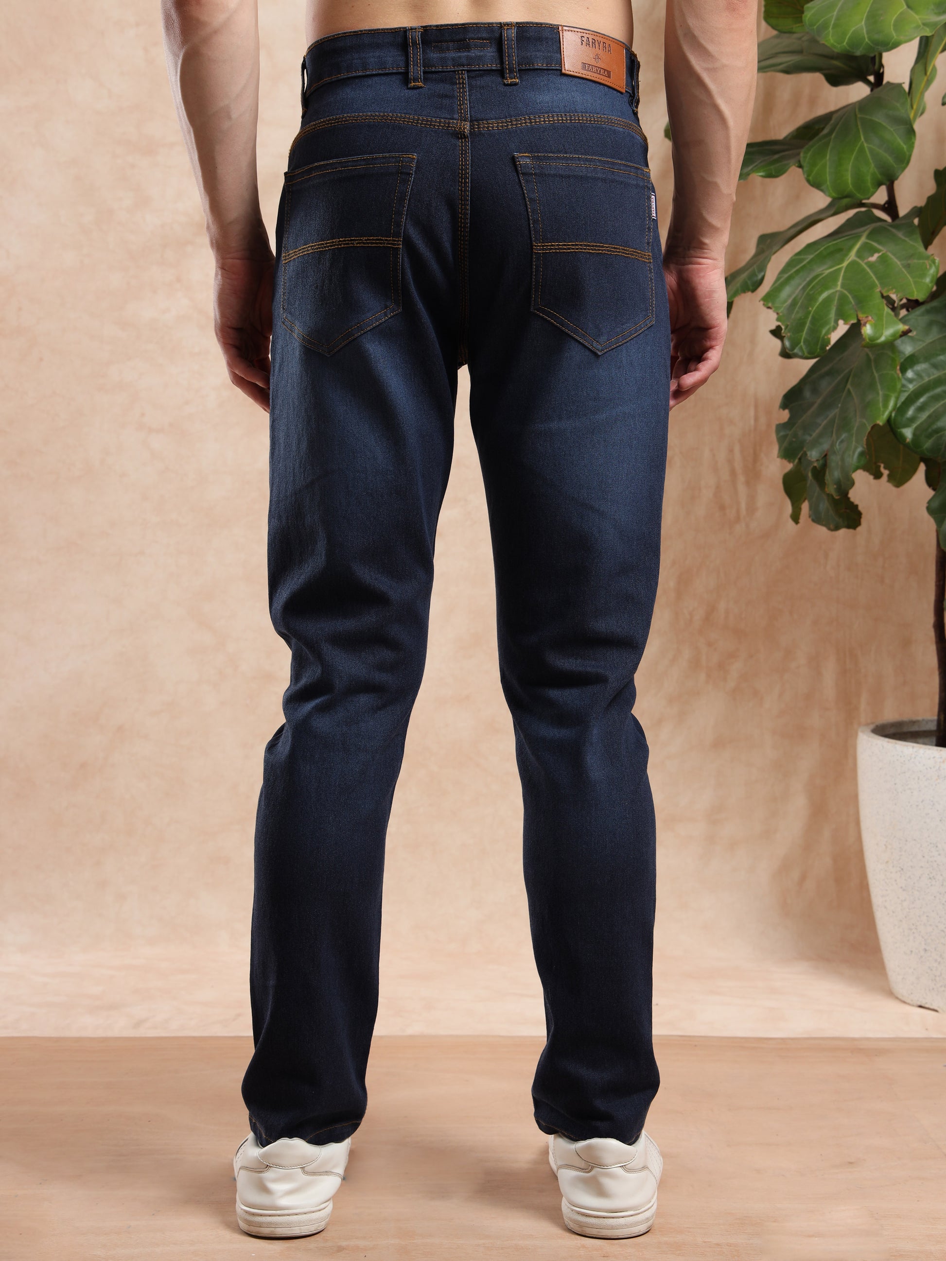 Men’s slim fit jeans with back patch pockets and leather brand tag