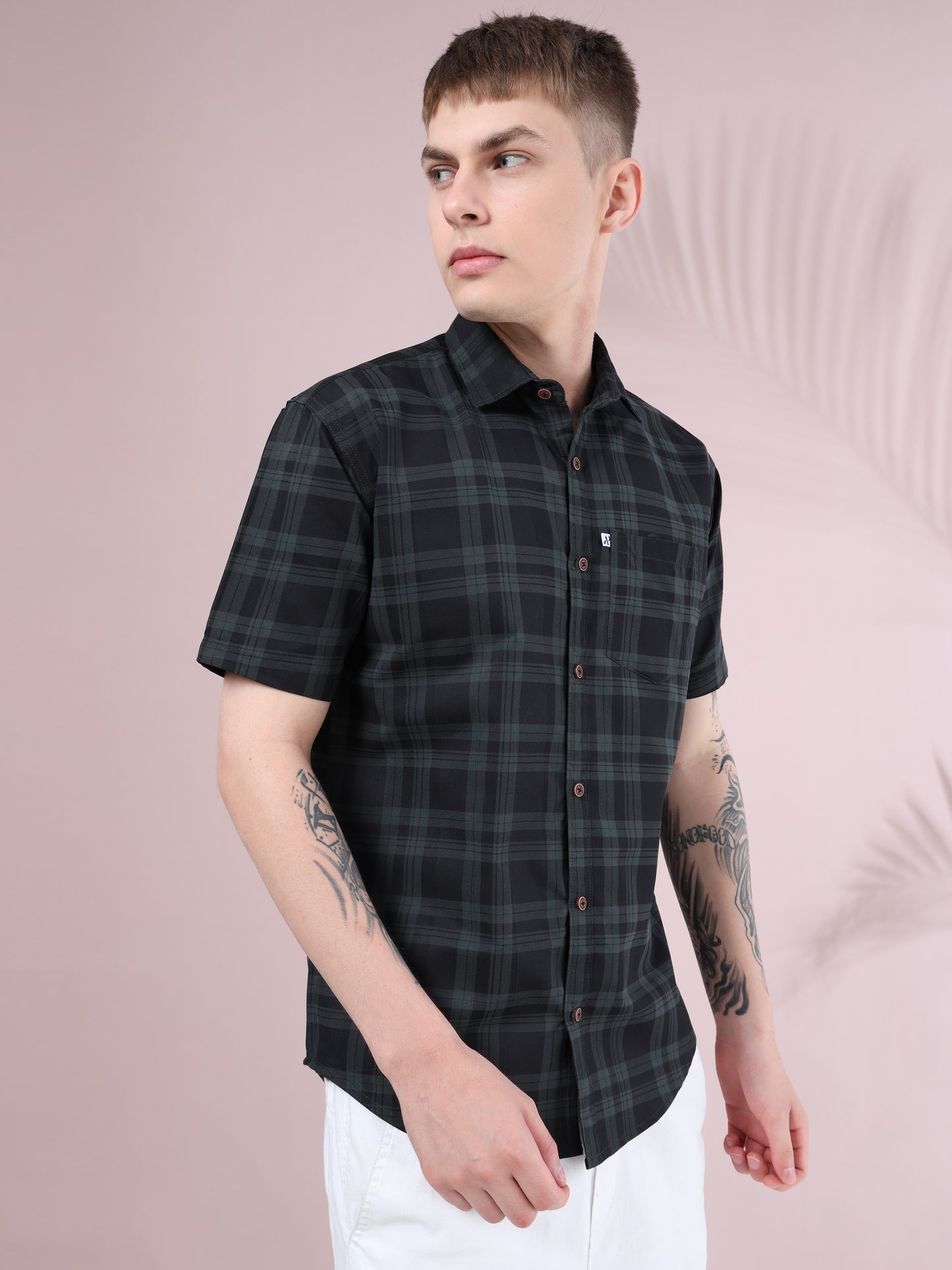Casual men’s half sleeve check shirt in black with green stripes