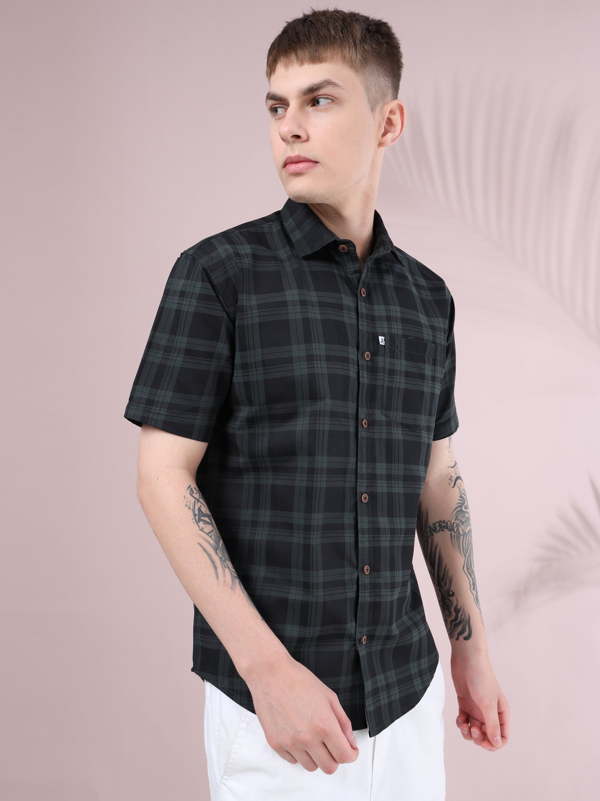 Casual men’s half sleeve check shirt in black with green stripes