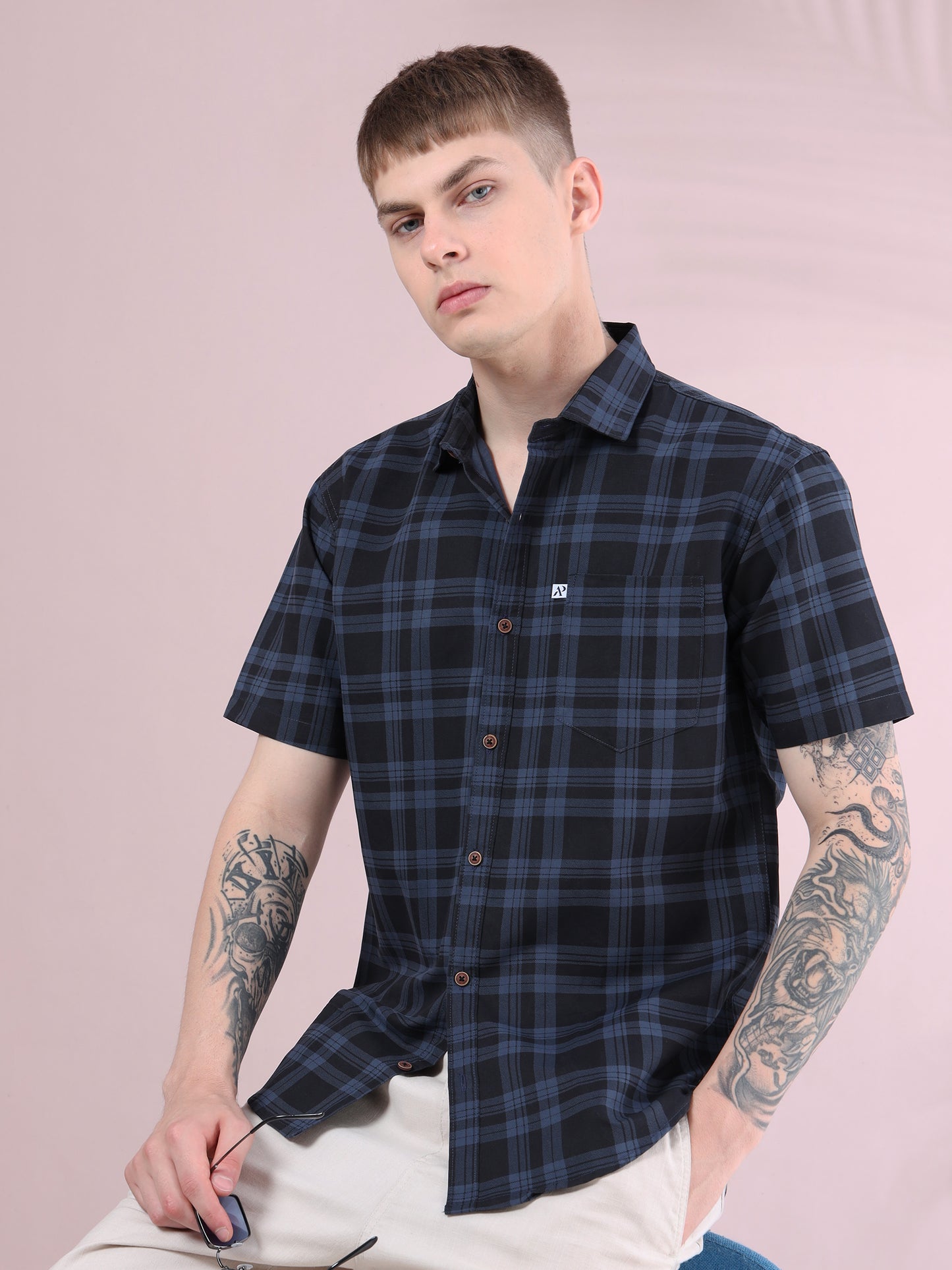 Men’s ash grey and black checked short sleeve cotton shirt styled with beige pants, casual modern look.