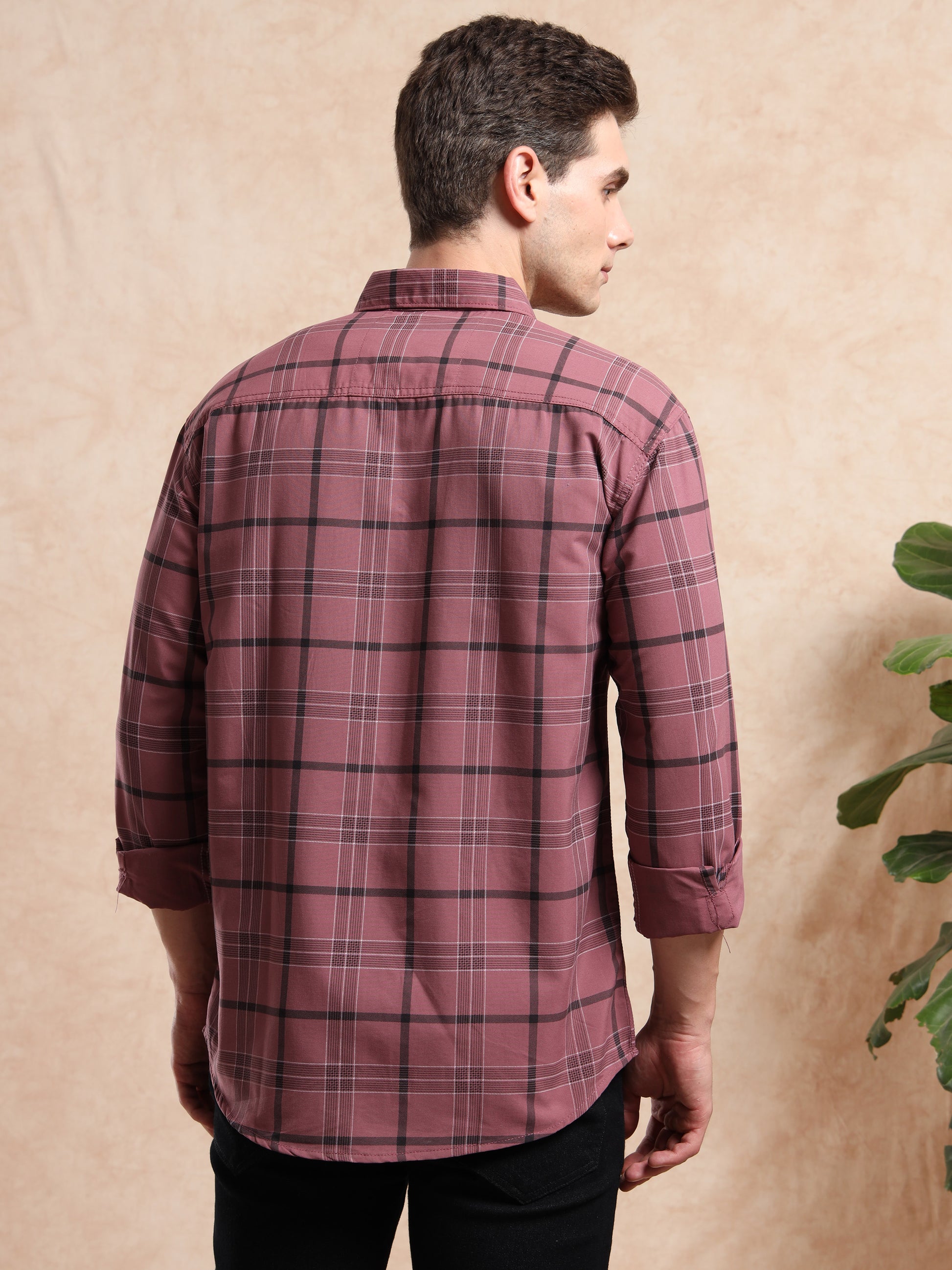 men’s maroon checked casual shirt with rolled-up sleeves.