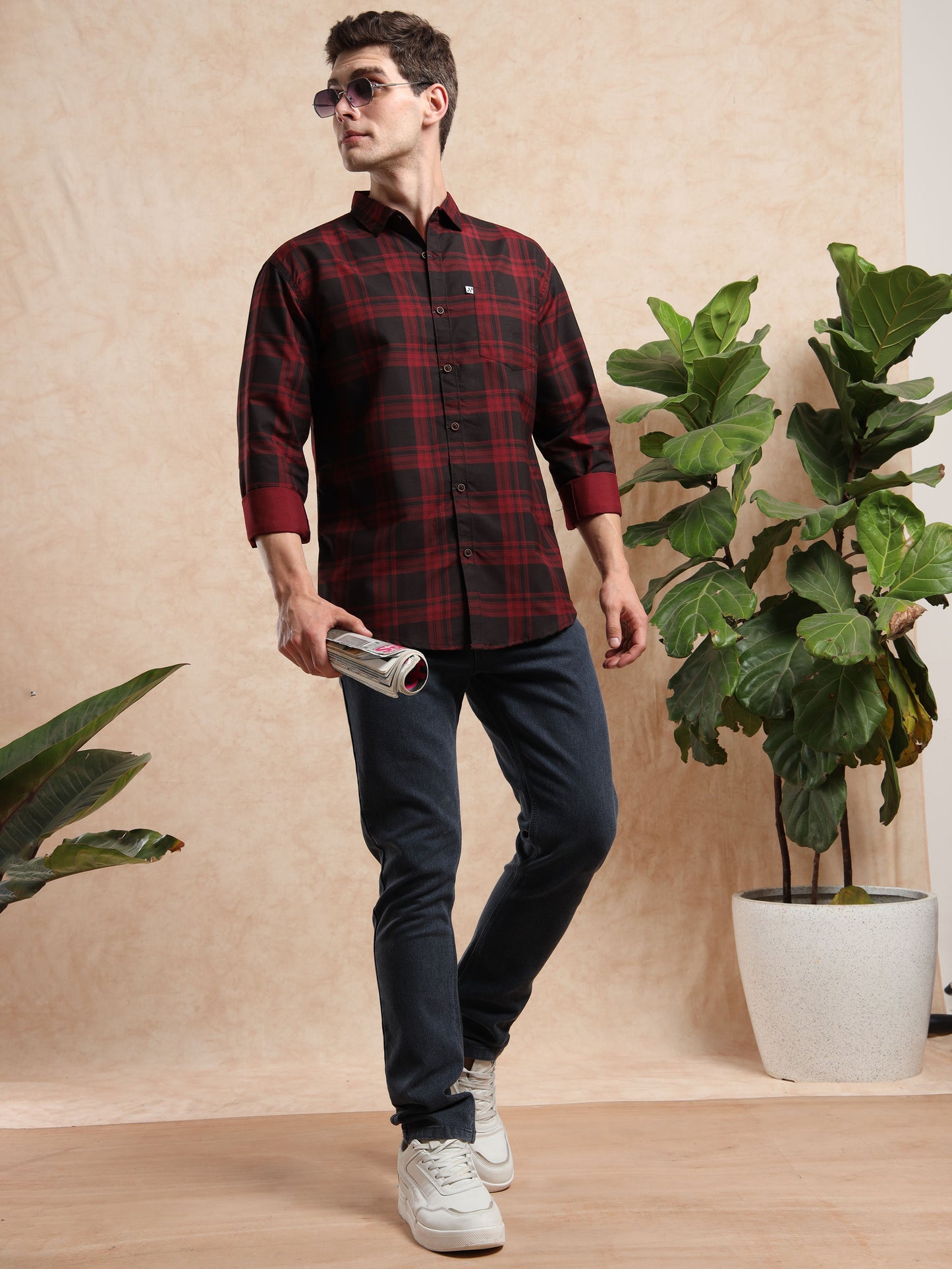 red black check shirt with blue jeans and white sneakers