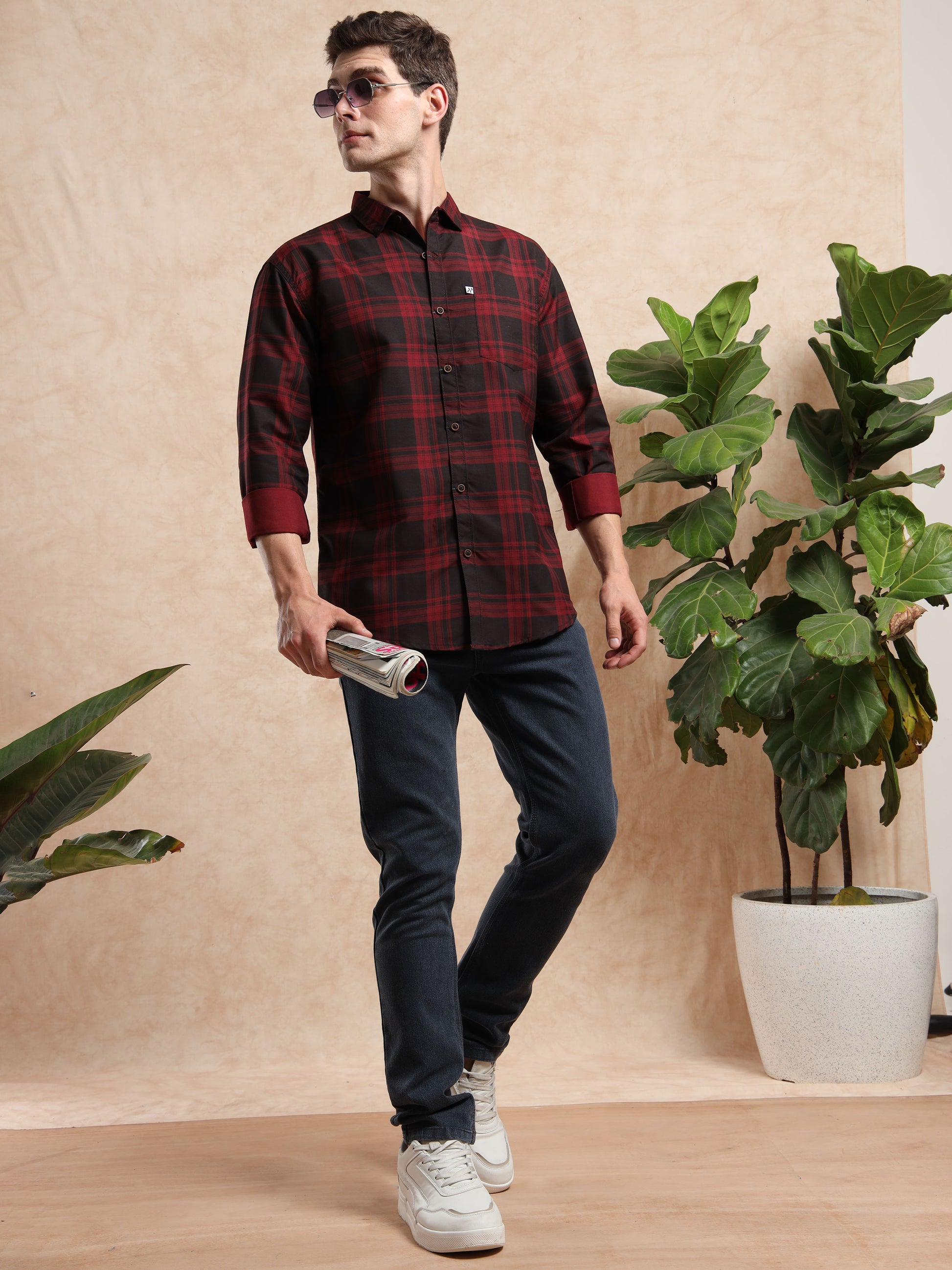 red black check shirt with blue jeans and white sneakers