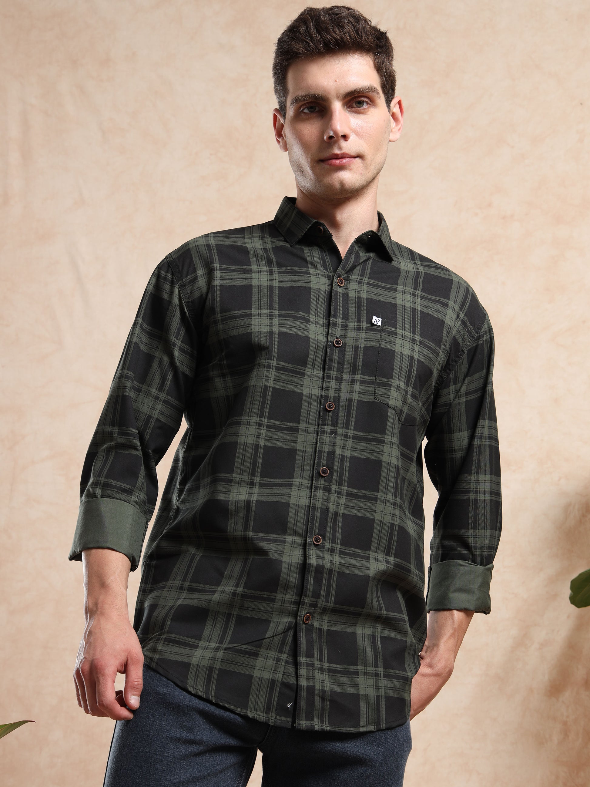 Men’s dark green and black checkered shirt with full sleeves, button-down style.