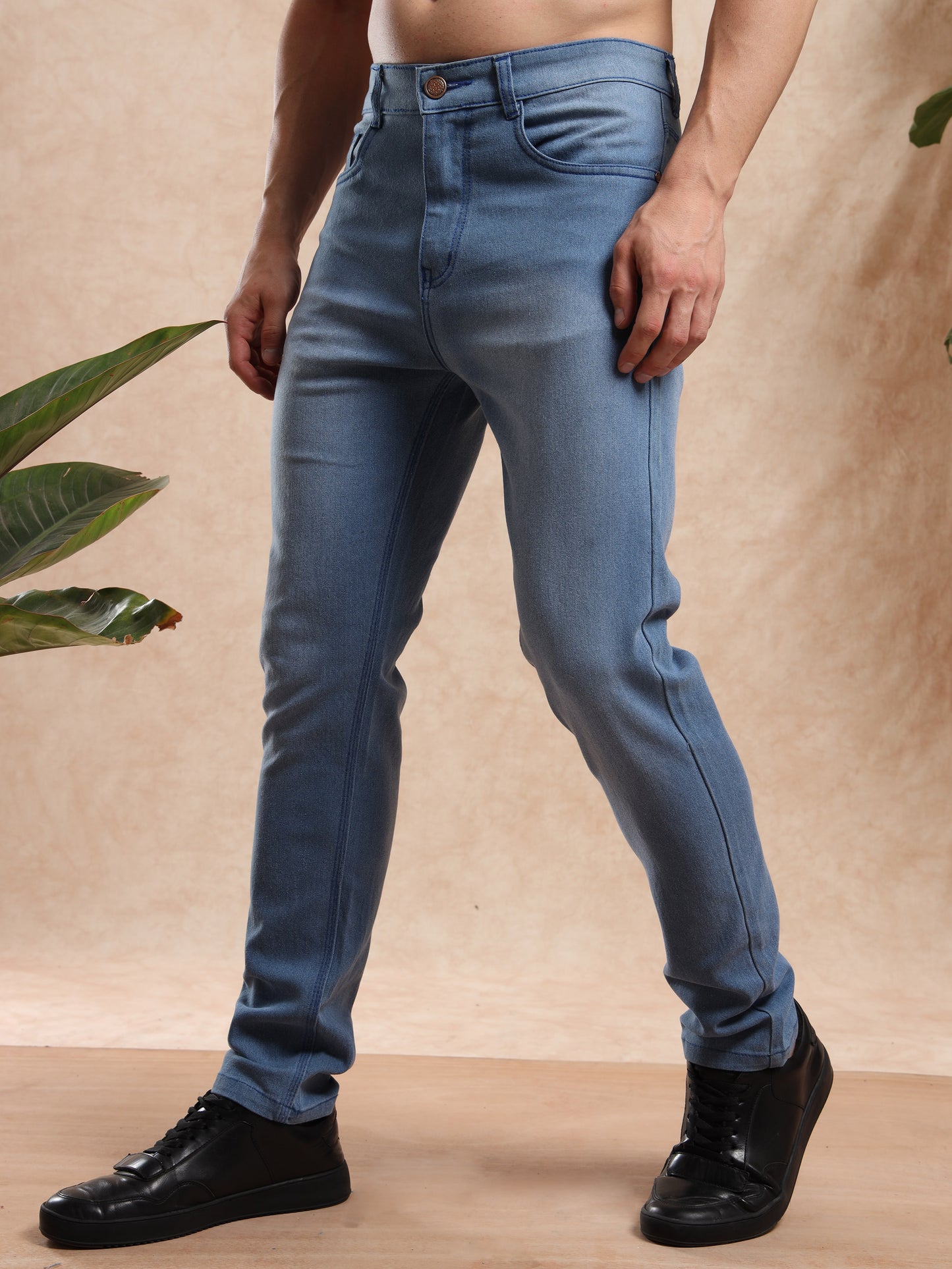 Stylish light blue men’s skinny jeans with mid-rise waist.