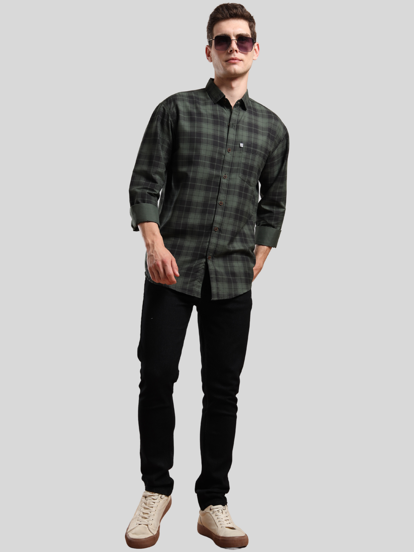 men’s casual checked shirt styled with black jeans and white sneakers
