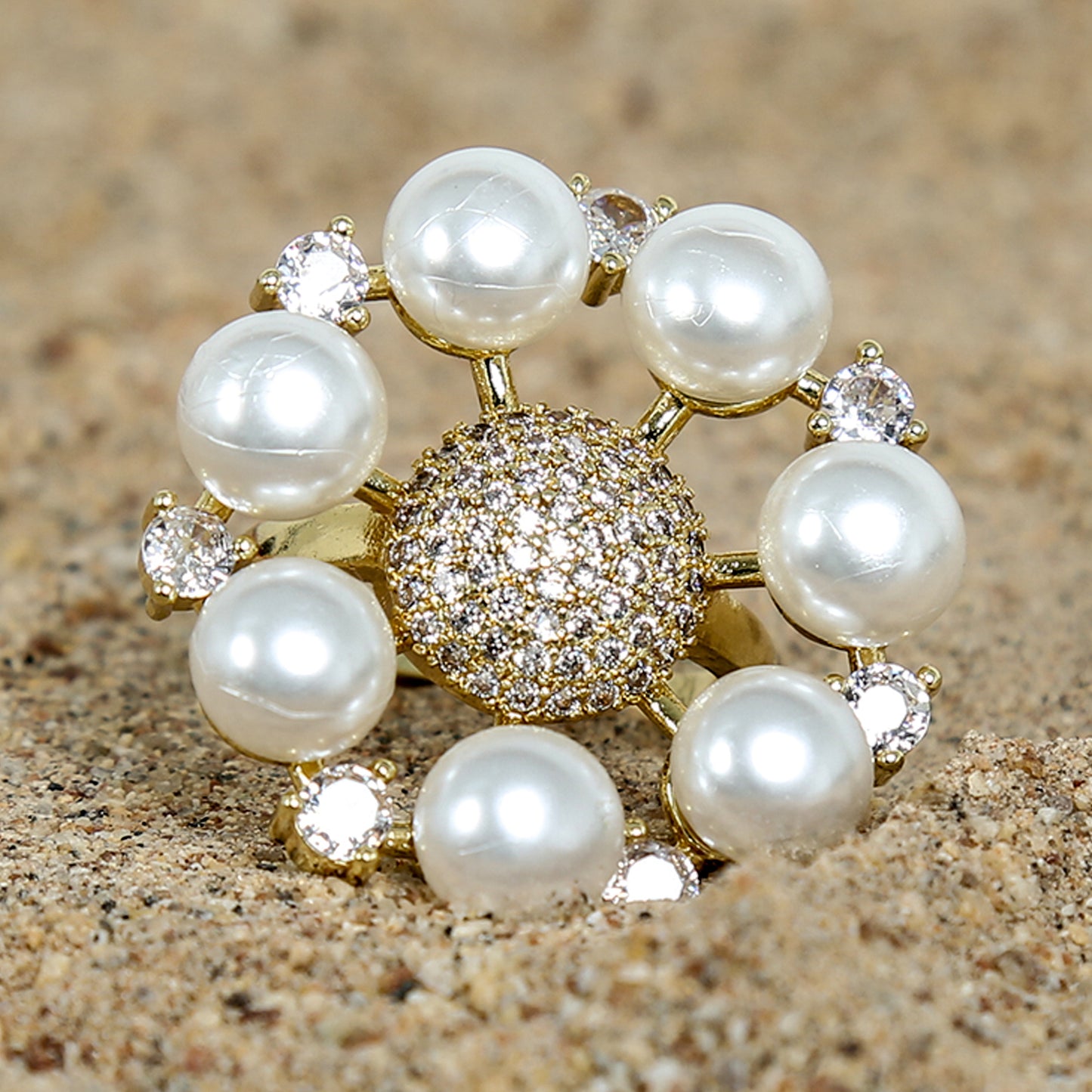 Gold-plated statement ring with a round cluster of sparkling zirconic stones