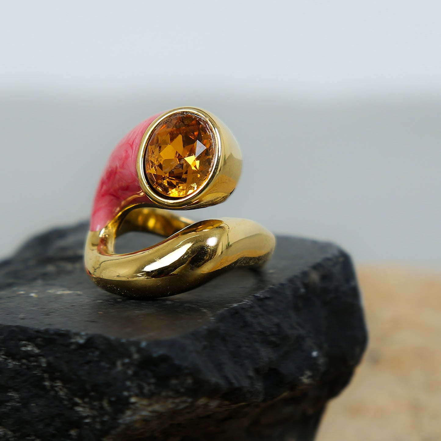 Gold-plated anti-tarnish ring with pink enamel band and oval-cut citrine gemstone