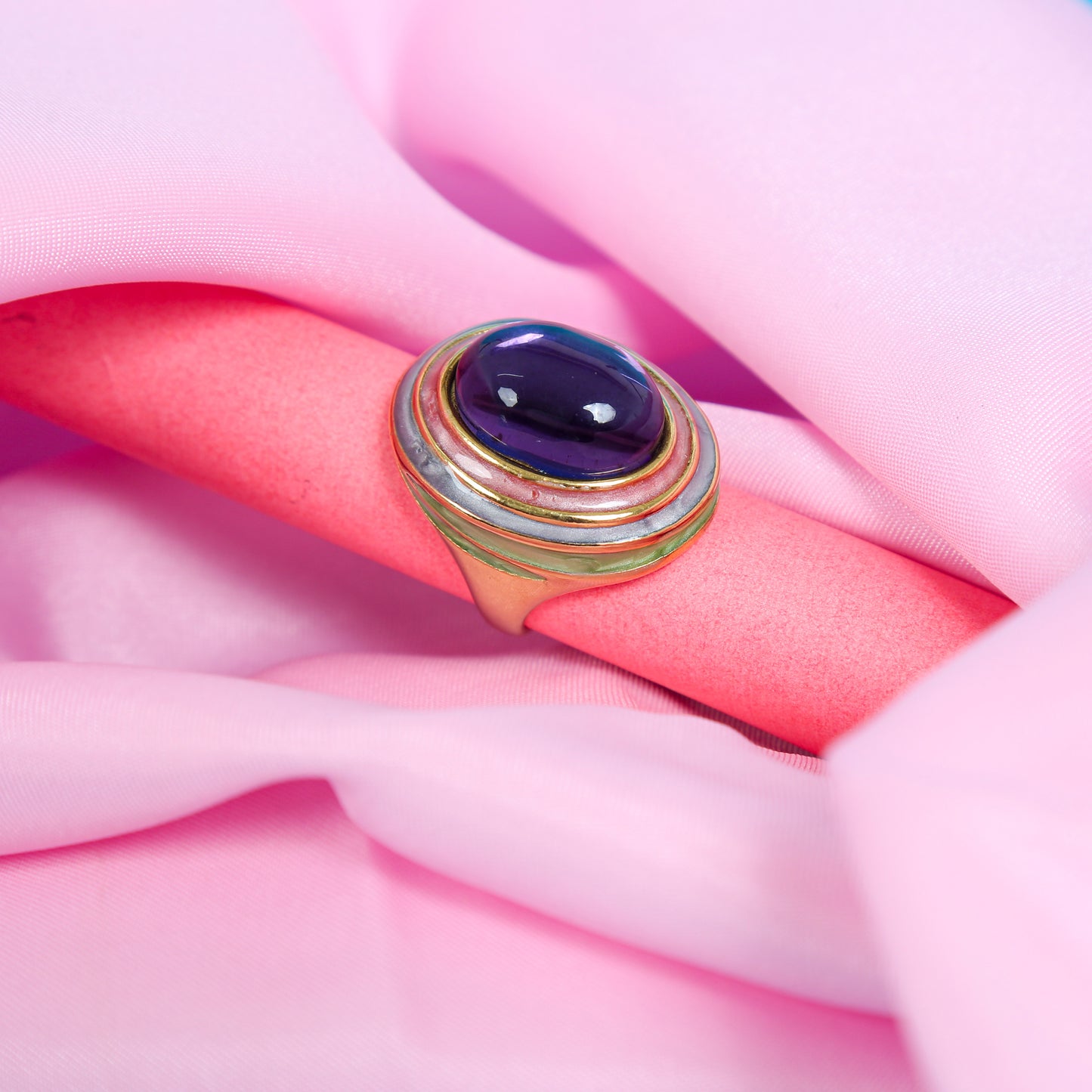 Gold-plated anti-tarnish ring with a large oval purple gemstone.
