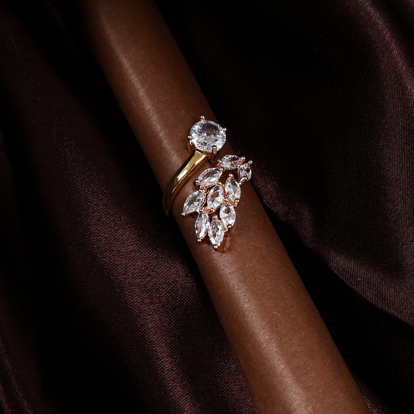 Elegant gold plated zirconic stone ring with a leaf cluster design