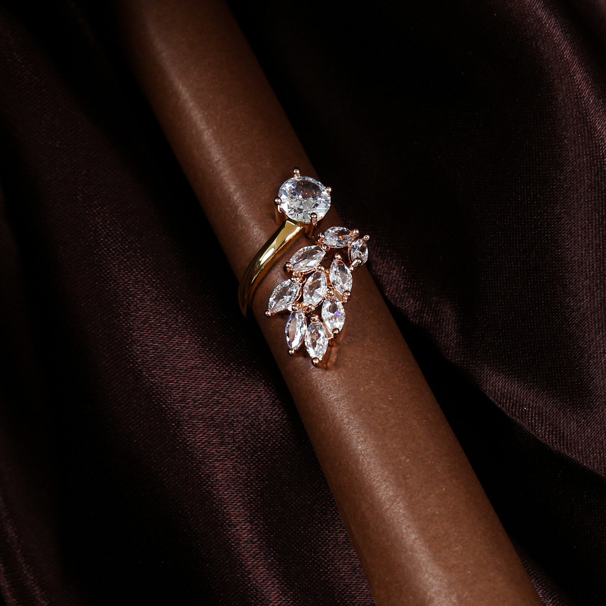 Elegant gold plated zirconic stone ring with a leaf cluster design