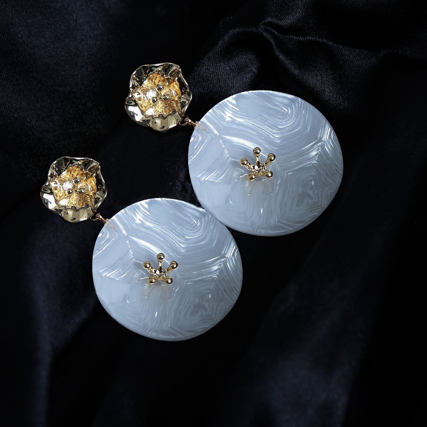 Stylish oversized white circular drop earrings with gold hammered floral studs