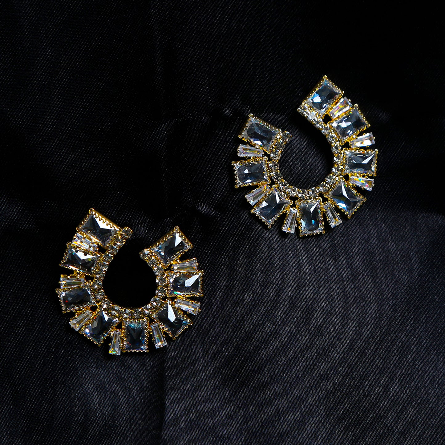 Gold-plated hoop earrings with square-cut zircon stones arranged in a half-moon design