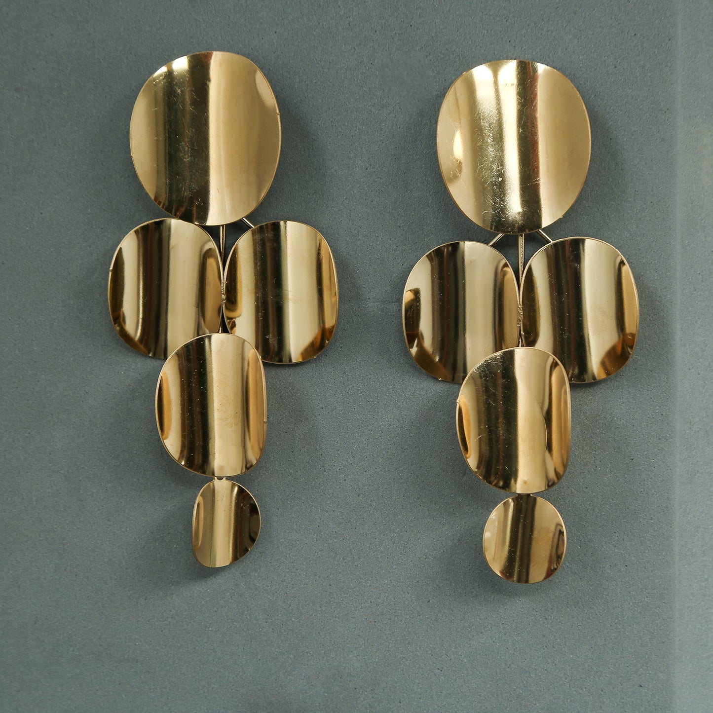 gold statement drop earrings with multiple circular geometric discs