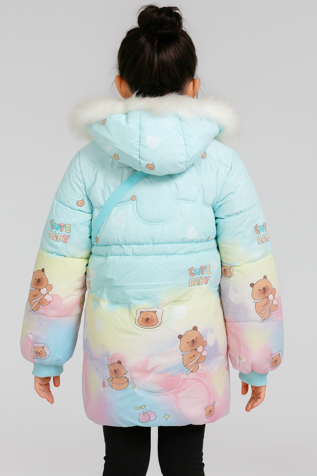 Back view of a light blue winter coat with pastel rainbow gradient, white faux fur-trimmed hood, and cartoon bear prints, featuring the text "Cute Baby" on the sleeves and back.