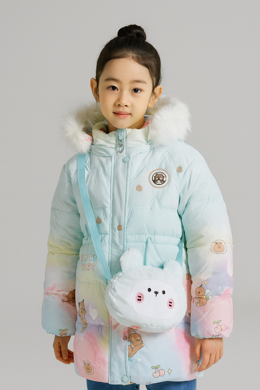 a pastel-colored winter jacket with cartoon bear and cherry prints, featuring a white faux fur-trimmed hood, and carrying a small white crossbody bag shaped like a cute animal face.