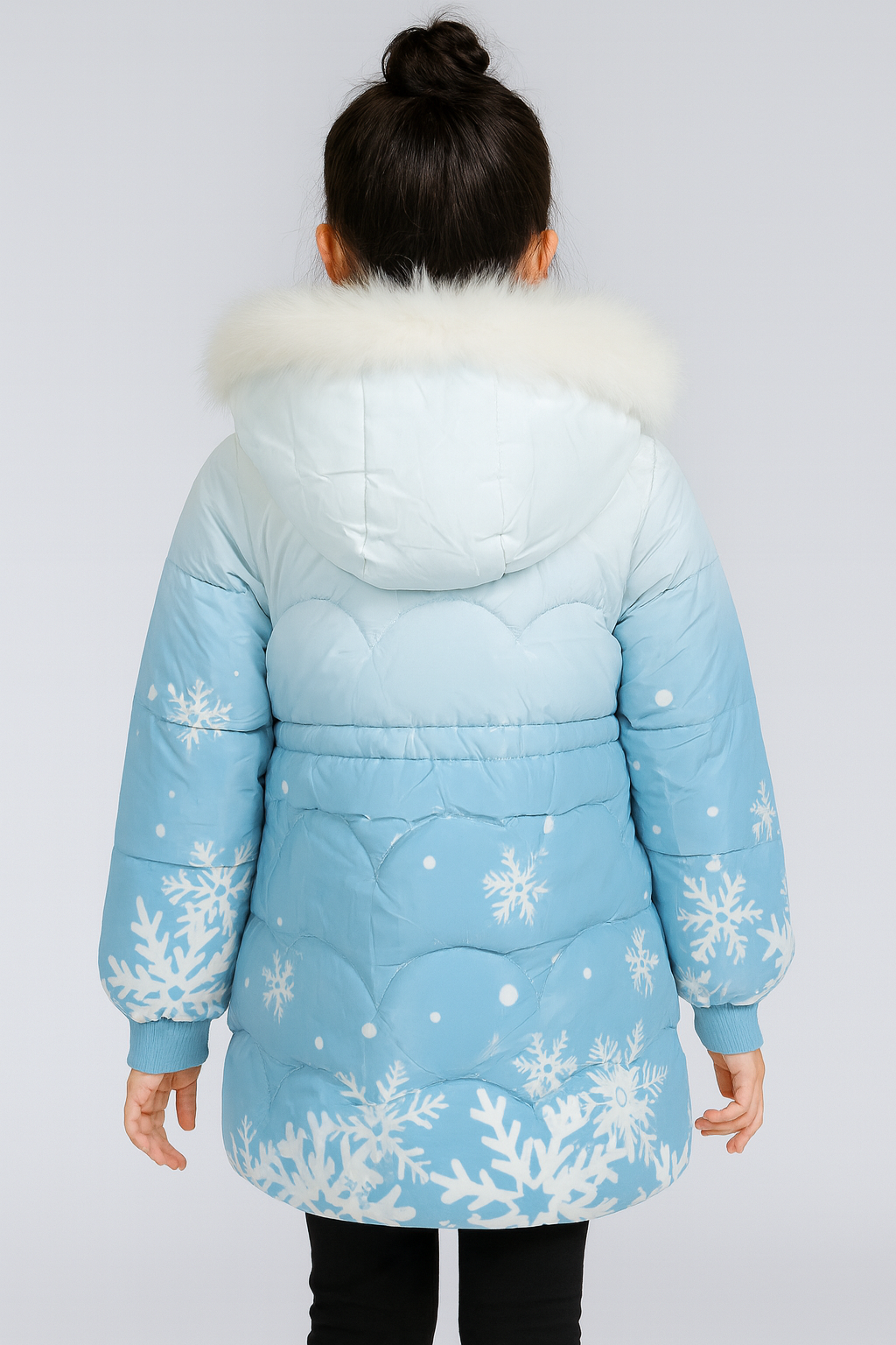 Back view of a light blue winter puffer jacket with white fur trim on the hood, decorated with white snowflake patterns