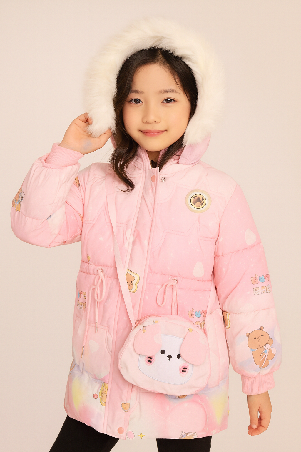 a light pink winter coat with cute cartoon prints, a white faux fur-lined hood, and a small matching crossbody bag