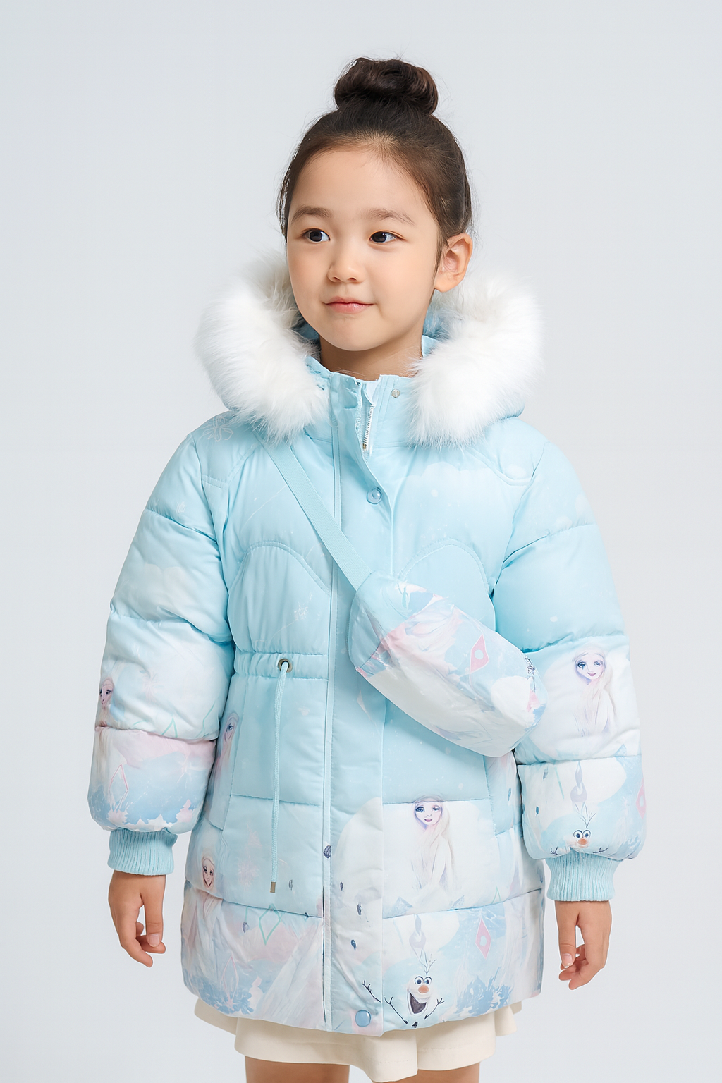 a light blue Frozen-themed winter jacket with white faux fur hood, featuring Elsa and Olaf prints, and carrying a matching crossbody bag