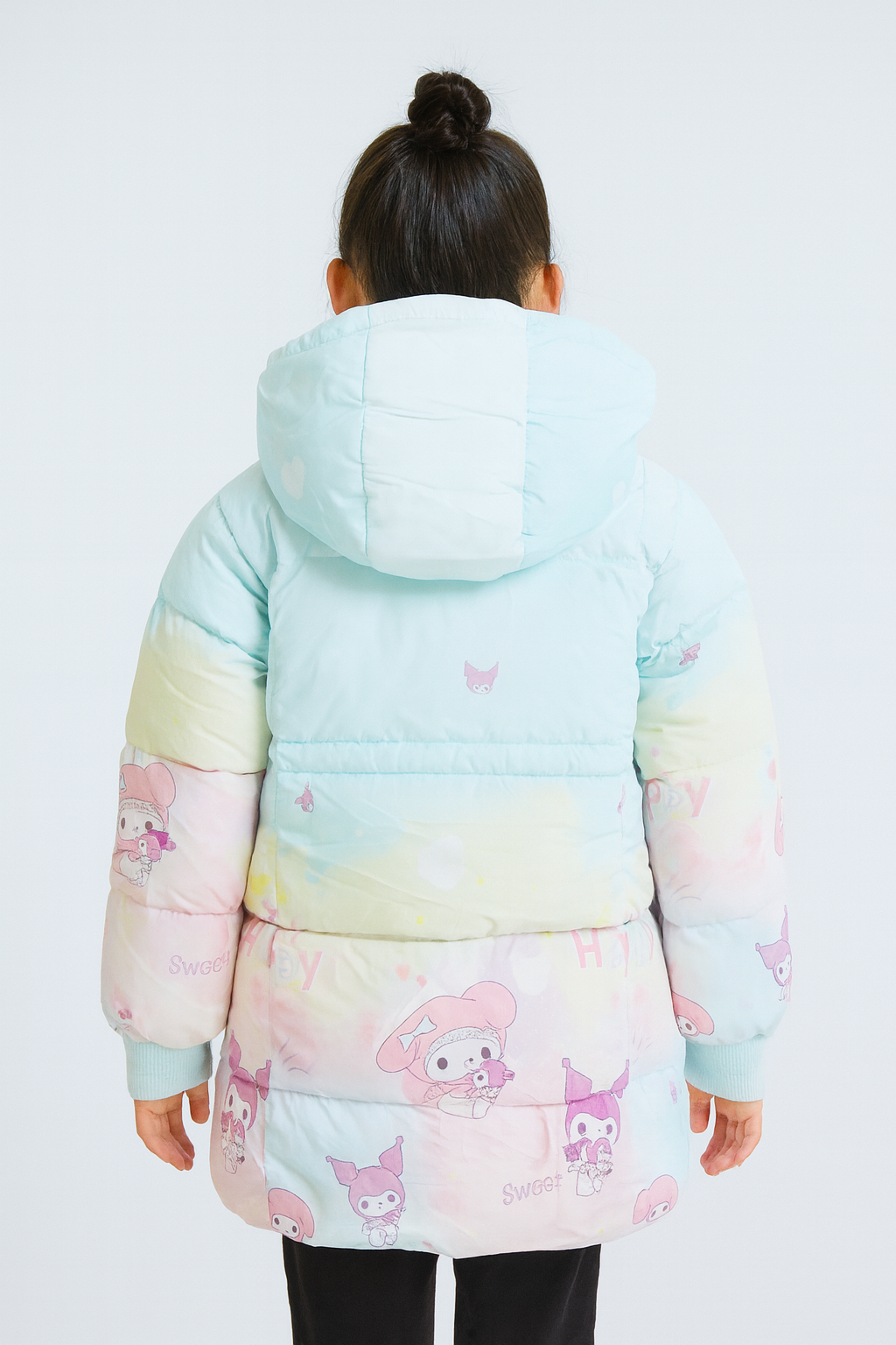 Back view of  a pastel-colored puffer jacket with a hood, featuring mint green, pink, and yellow tones. The jacket is decorated with cartoon character prints of My Melody and Kuromi, along with playful text and motifs