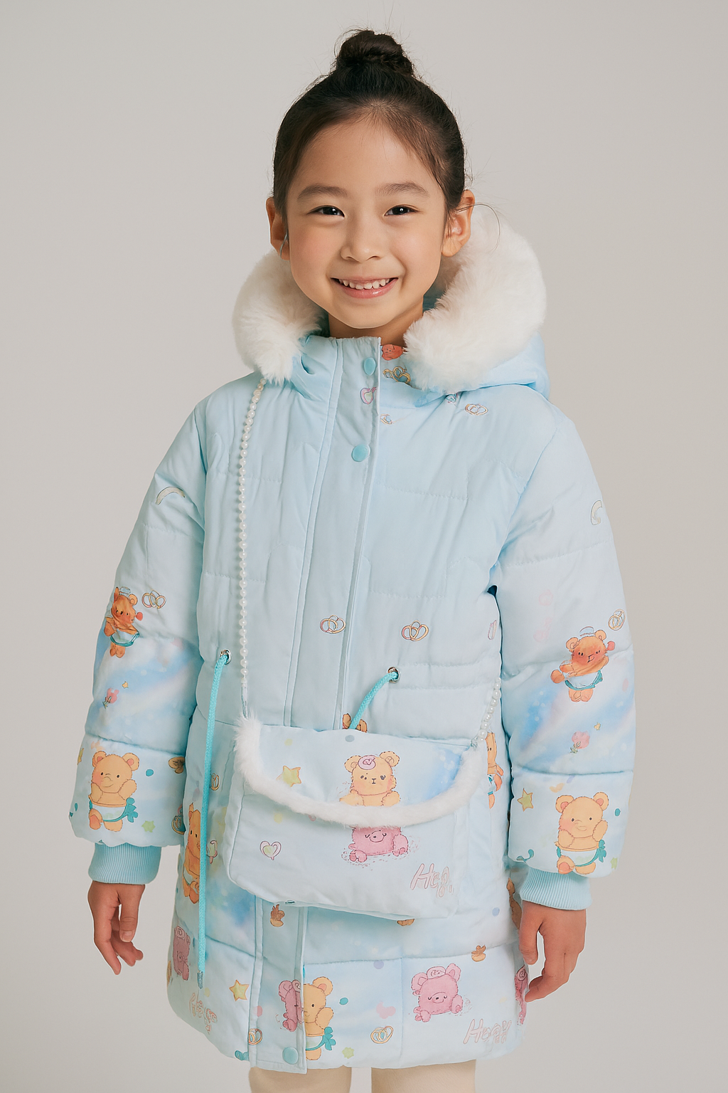 a light blue winter coat with a white faux fur hood, decorated with colorful teddy bear prints and small patterns
