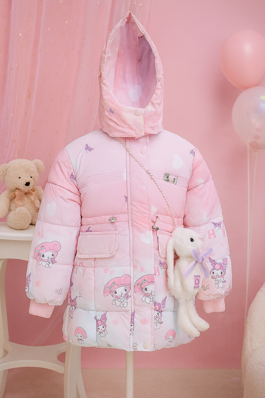 a light pink hooded puffer jacket with My Melody cartoon prints, heart patterns, and a pearl strap holding a plush white bunny bag with a pastel bow