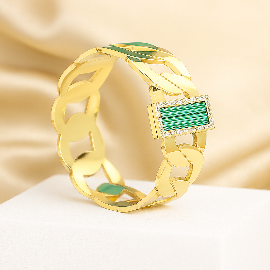 Elegant gold chain bracelet featuring a green malachite stone bordered with cubic zirconia