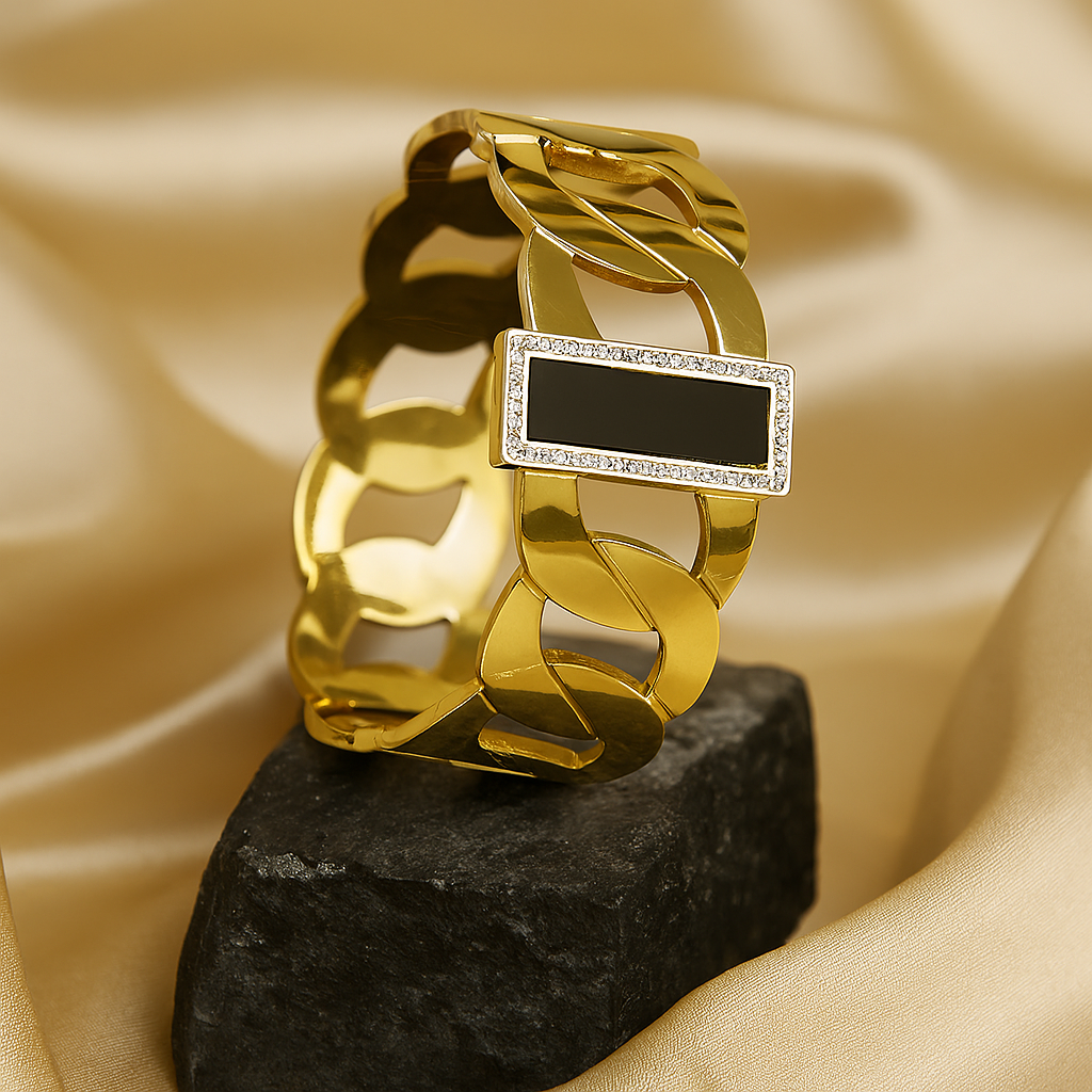 Elegant gold-plated chain link bracelet with a rectangular black onyx centerpiece framed by cubic zirconia