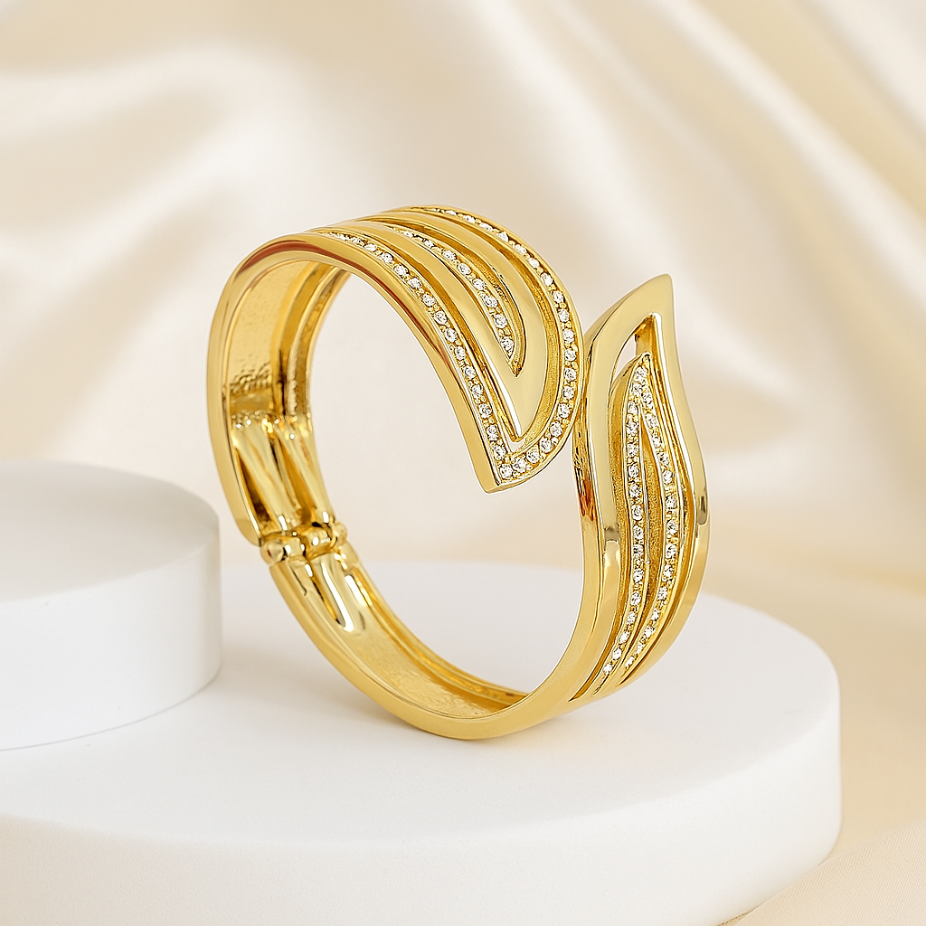 Luxurious gold leaf design bracelet with shimmering cubic zirconia embellishments