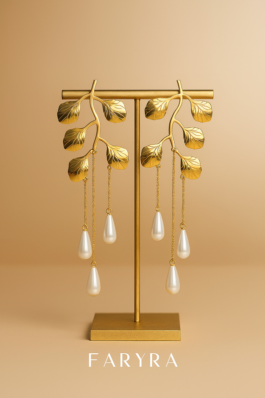 Gold leaf-inspired statement earrings with dangling pearl drops