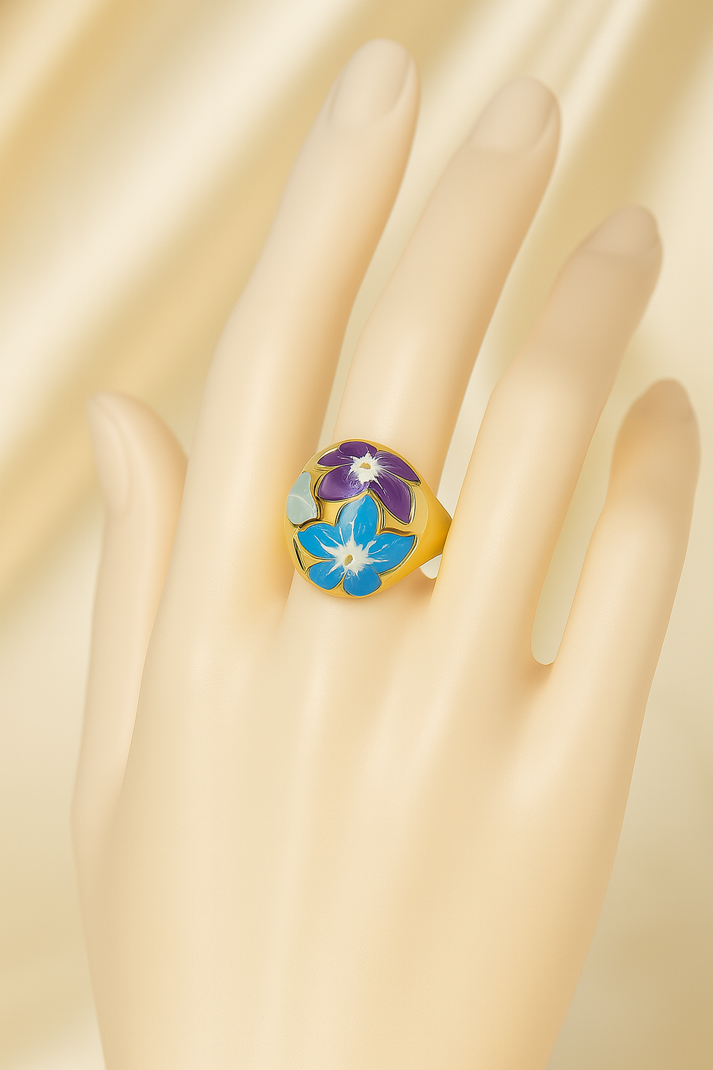 Gold-plated anti-tarnish floral enamel ring worn on mannequin