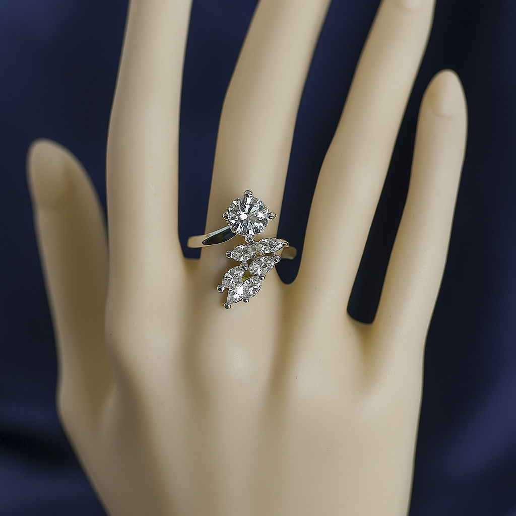 Stylish zirconic stone leaf design ring with a round solitaire centerpiece