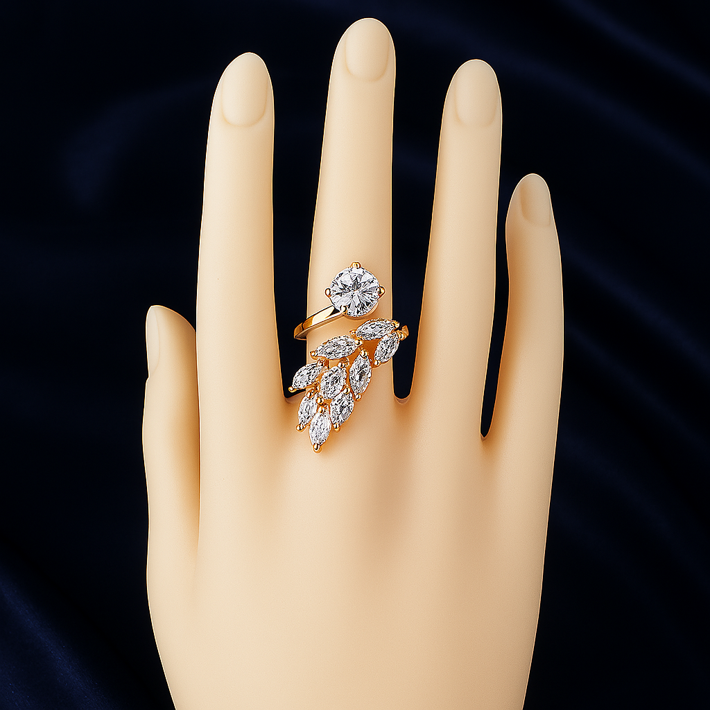 Stylish gold plated zirconic stone leaf design ring worn on a mannequin hand