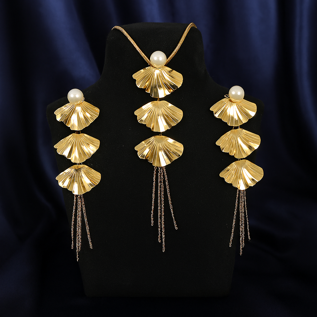 Elegant gold fan-shaped necklace and matching long drop earrings with pearl studs and chain tassels