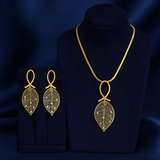 Elegant gold-plated leaf design necklace with matching drop earrings, featuring intricate filigree detailing