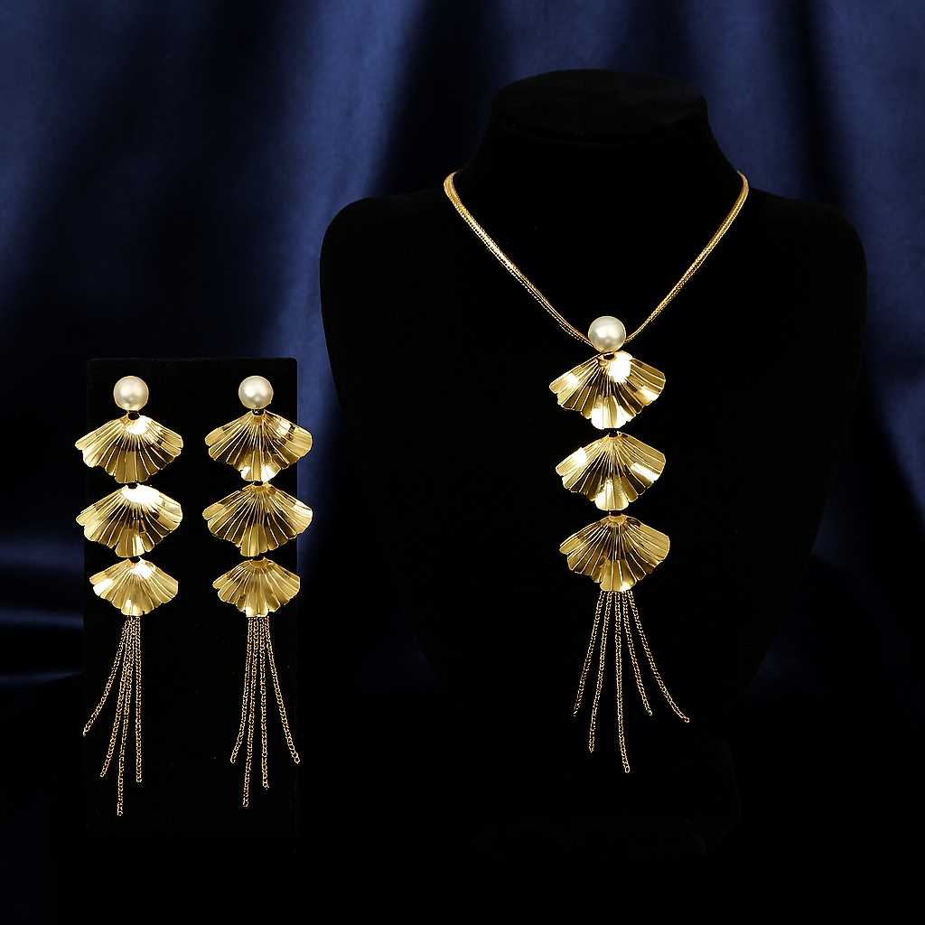 Luxurious gold fan leaf necklace with pearl accent and matching statement earrings