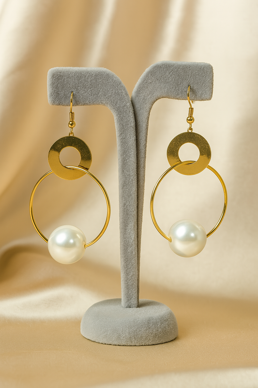 Gold hoop earrings with large pearl drop