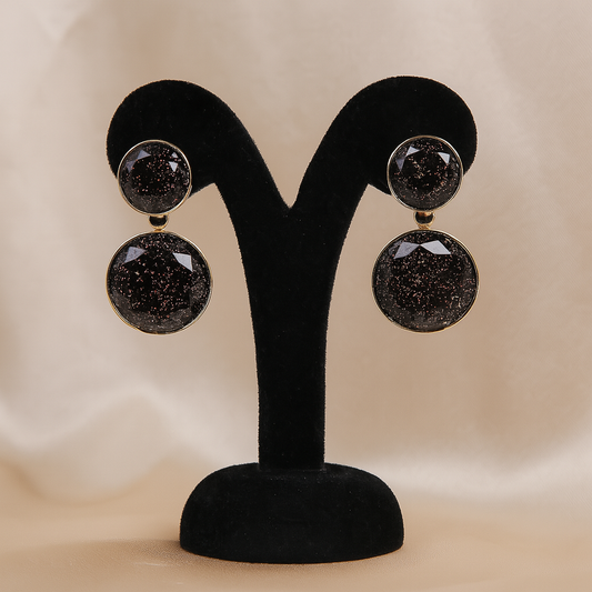 Stylish black glitter resin double round drop earrings with golden detailing