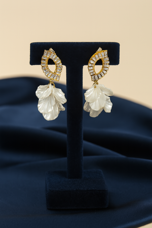 Chic gold-plated floral drop earrings featuring zircon accents and dangling white petal