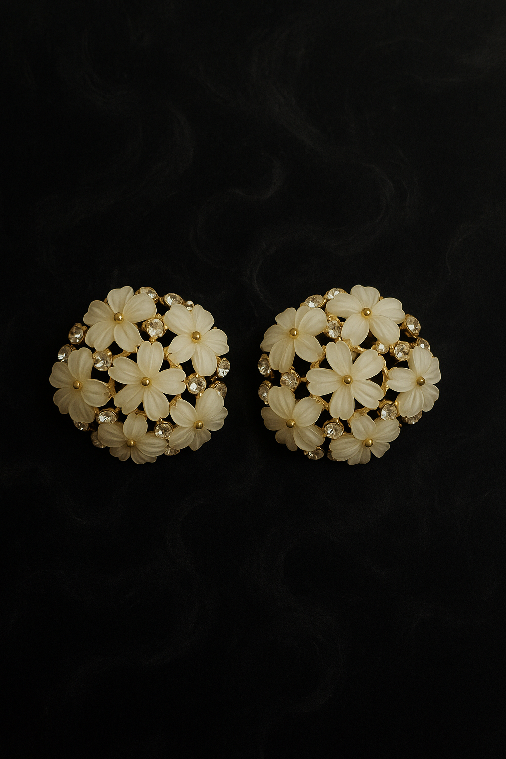 Chic gold-plated floral stud earrings with white flower petals and crystal embellishments
