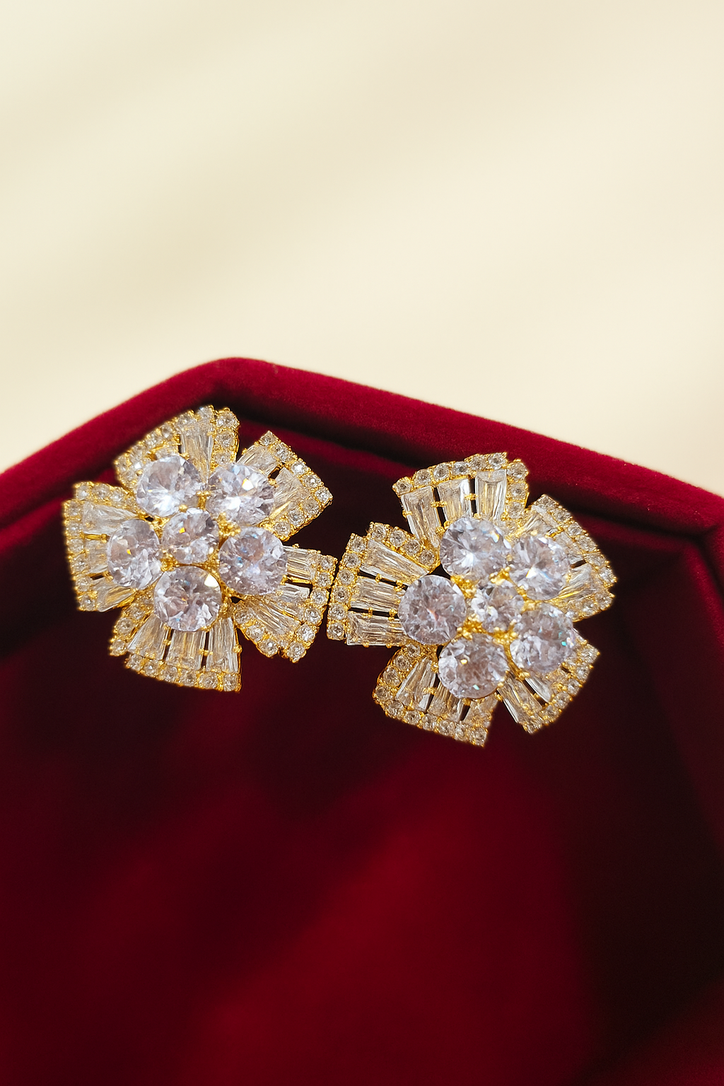 Elegant gold floral stud earrings encrusted with zircon stone