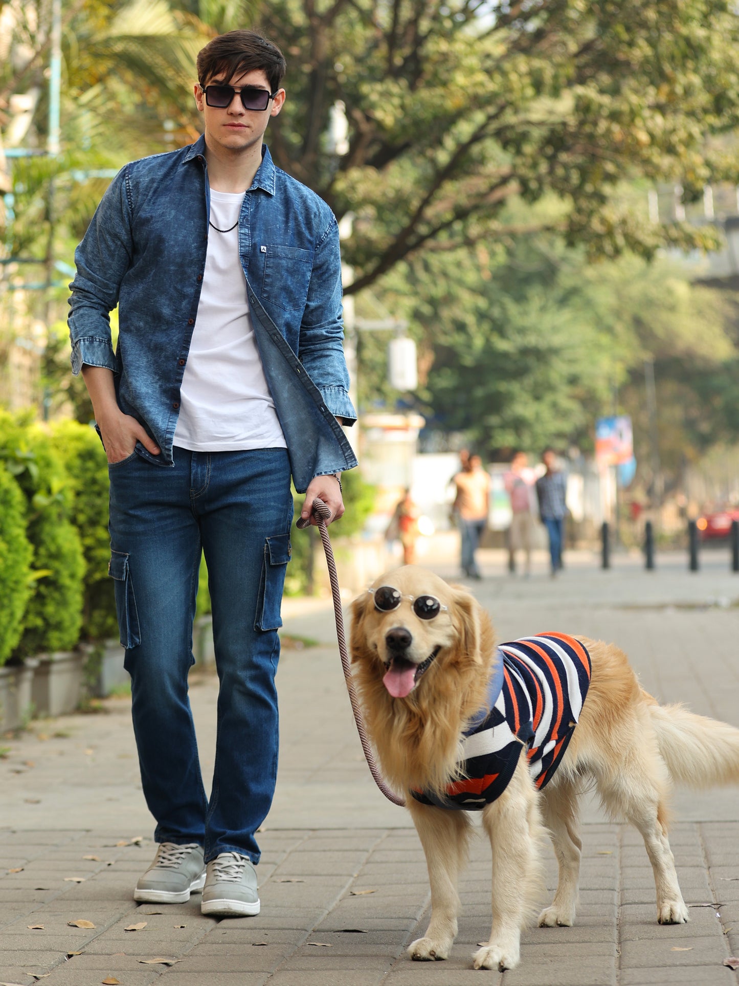 Casual men's blue shirt paired with light denim jeans