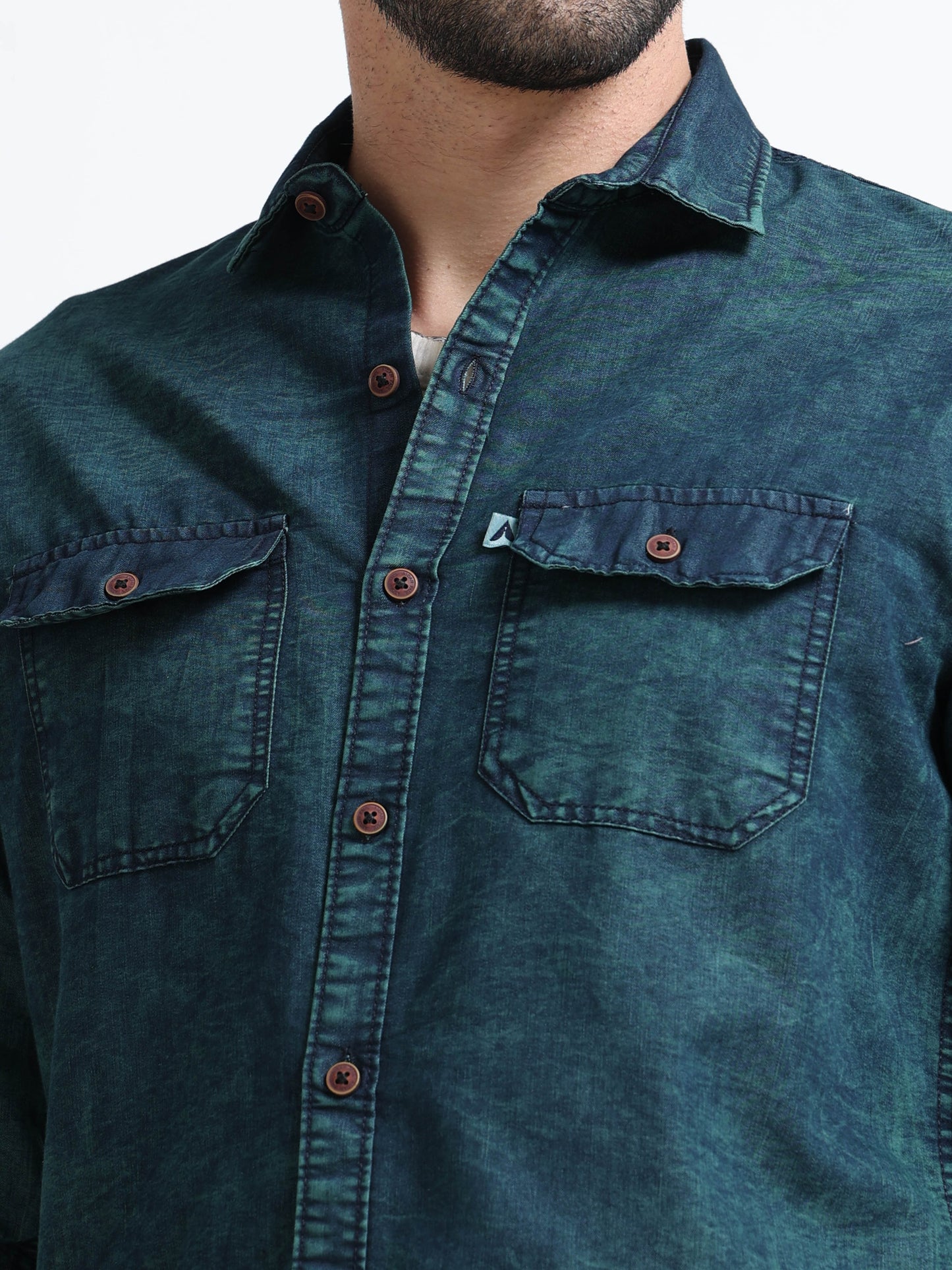Mens dark green acid wash denim with full sleeves rolled up, stylish casual men's overshirt with curved hem.