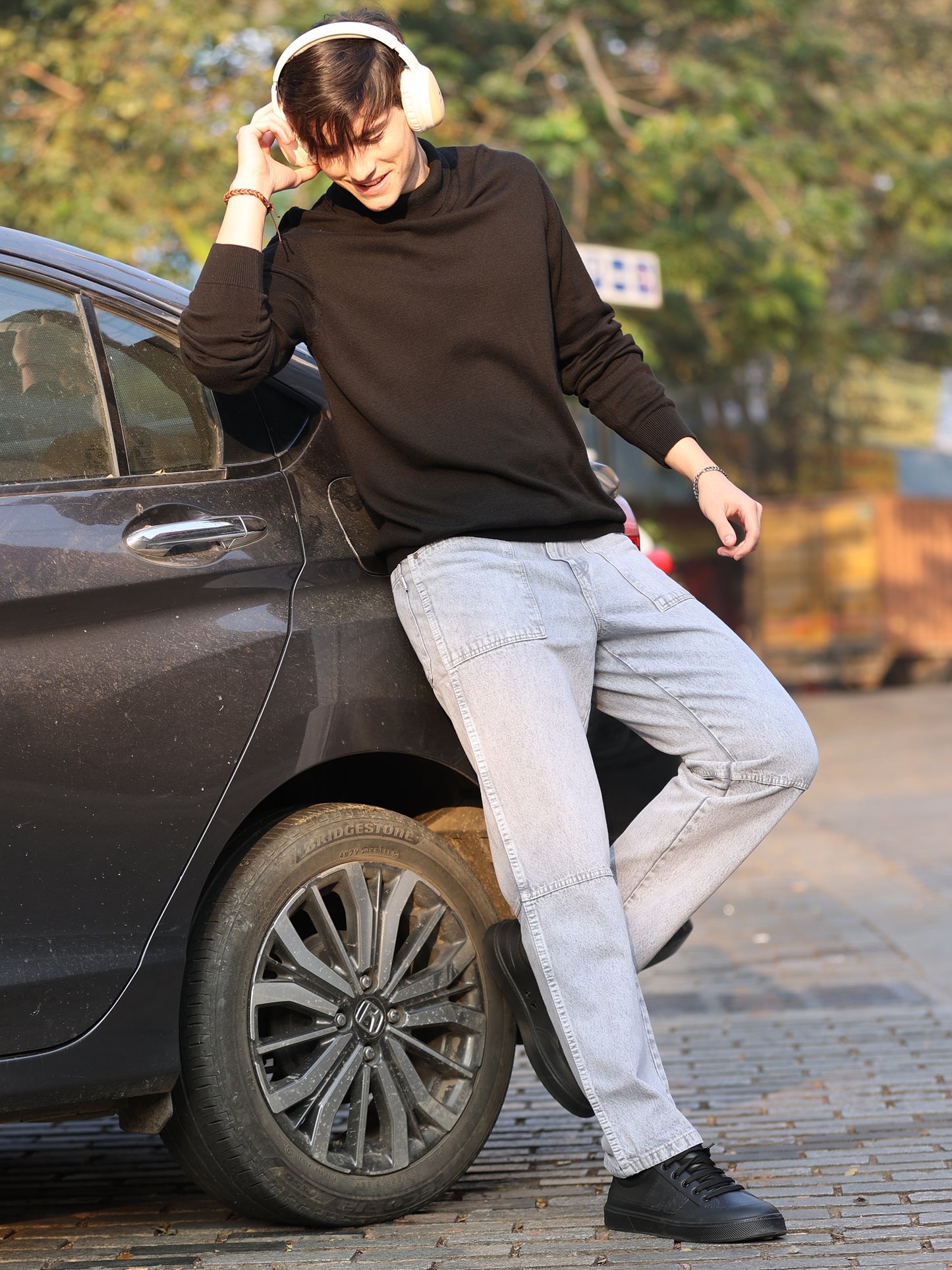 Fashionable men's straight leg grey jeans with subtle fade detailing