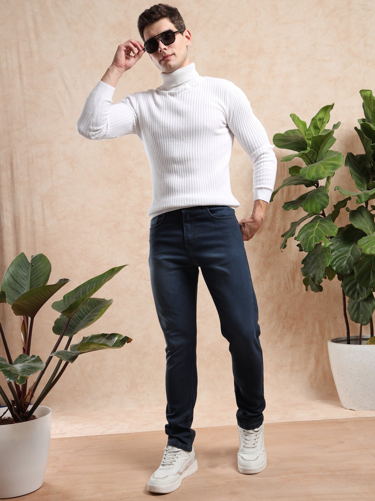 Men, casual outfit featuring slim fit dark wash jeans with sneakers.
