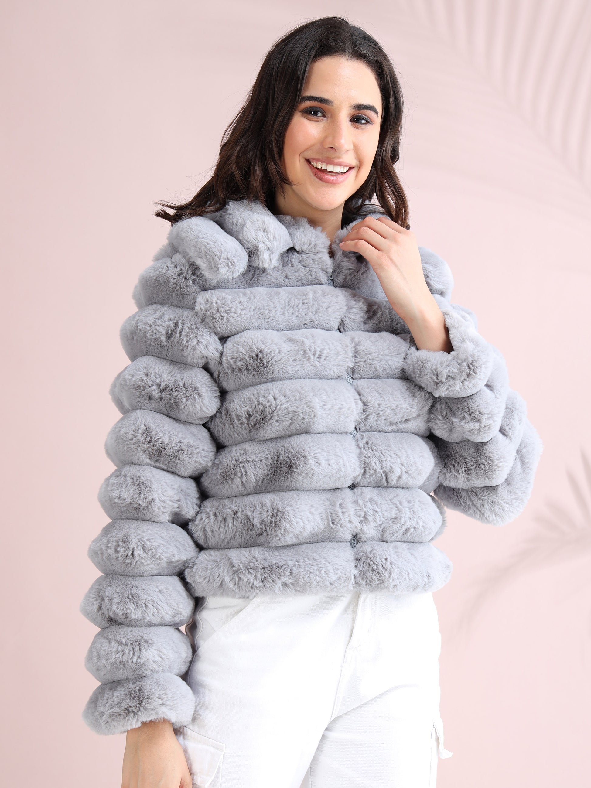 soft grey faux fur jacket, cozy winter wear styled with casual white bottoms.