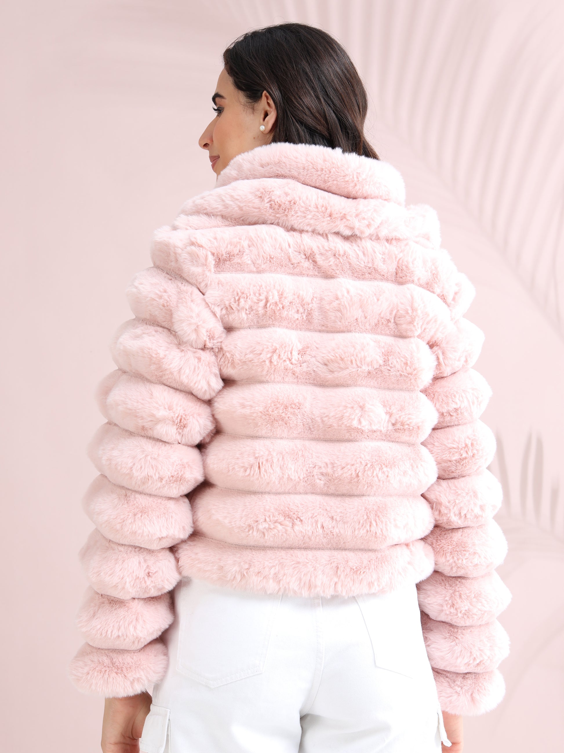pink faux fur jacket showing plush texture and cropped fit